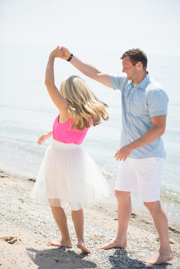 Bride and groom dancing on the beach during Traverse City Engagement Session