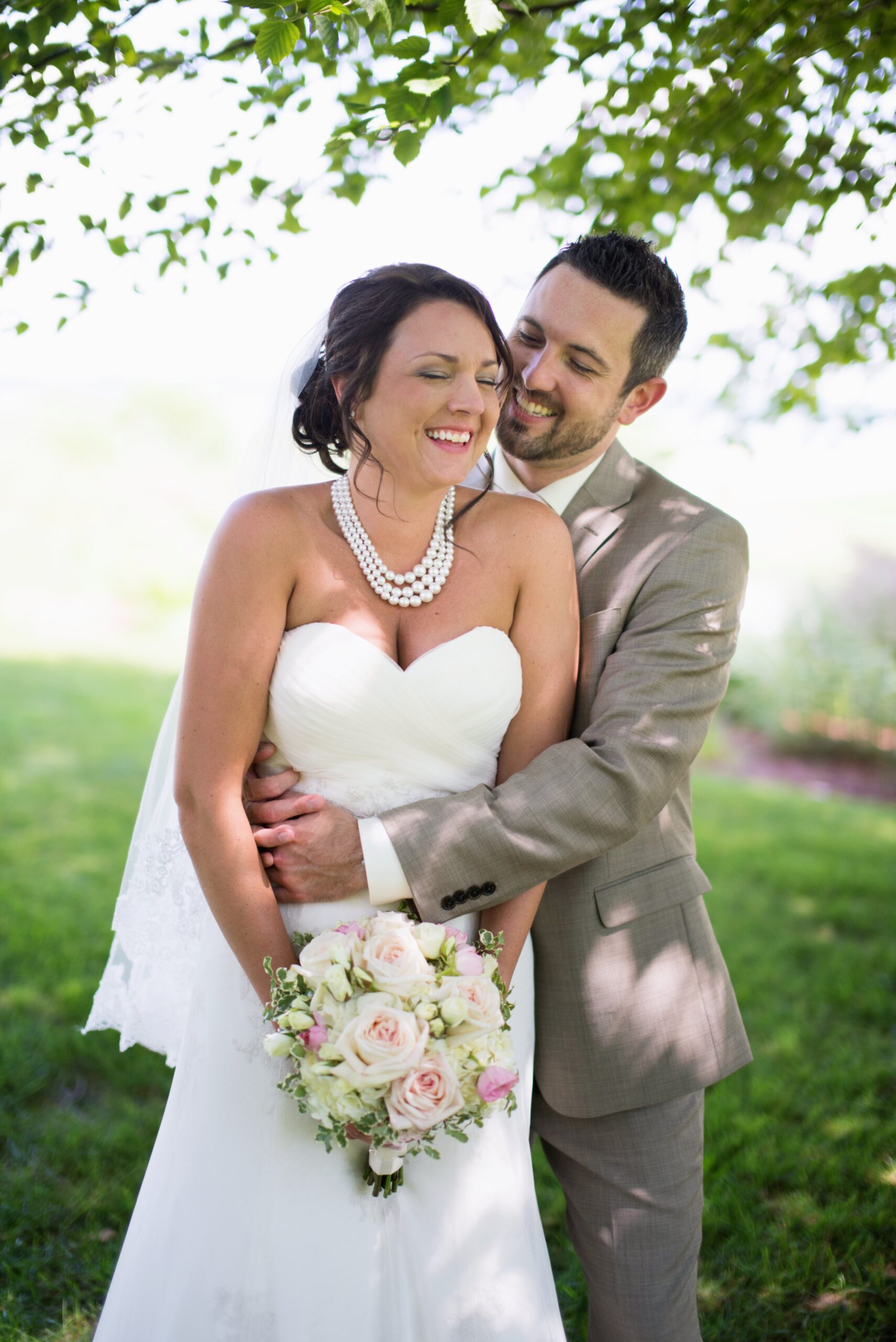 bride and groom embracing at wedding in traverse city michigan