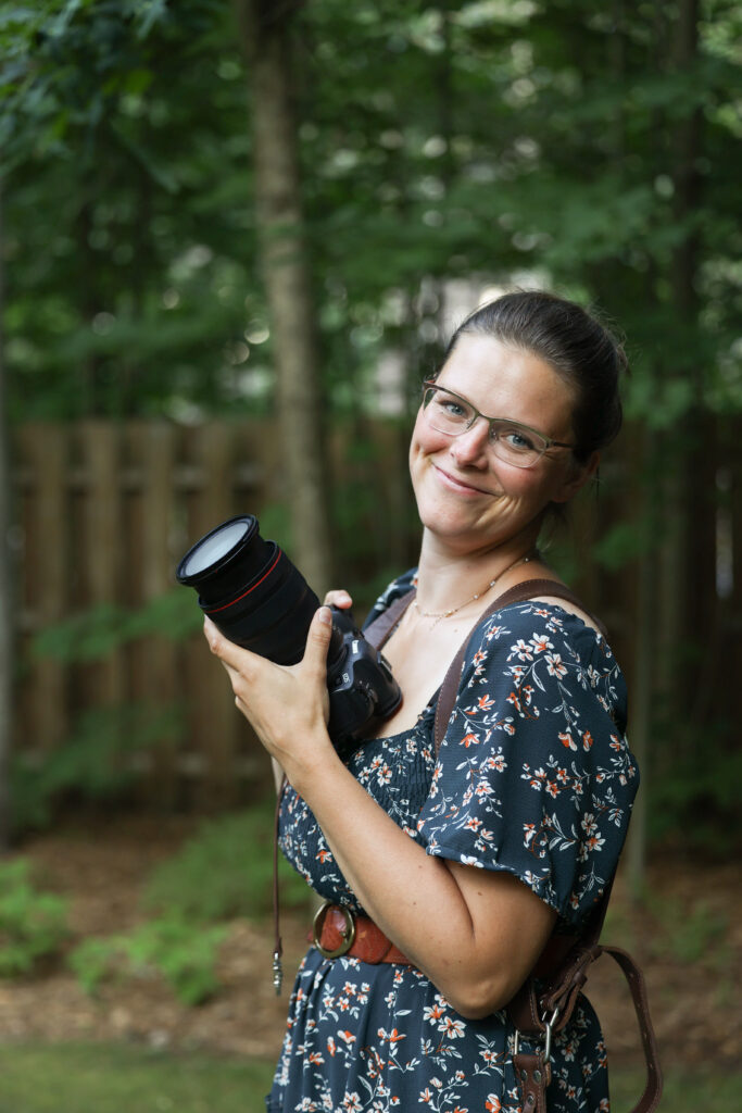 traverse city photographer smiling with camera