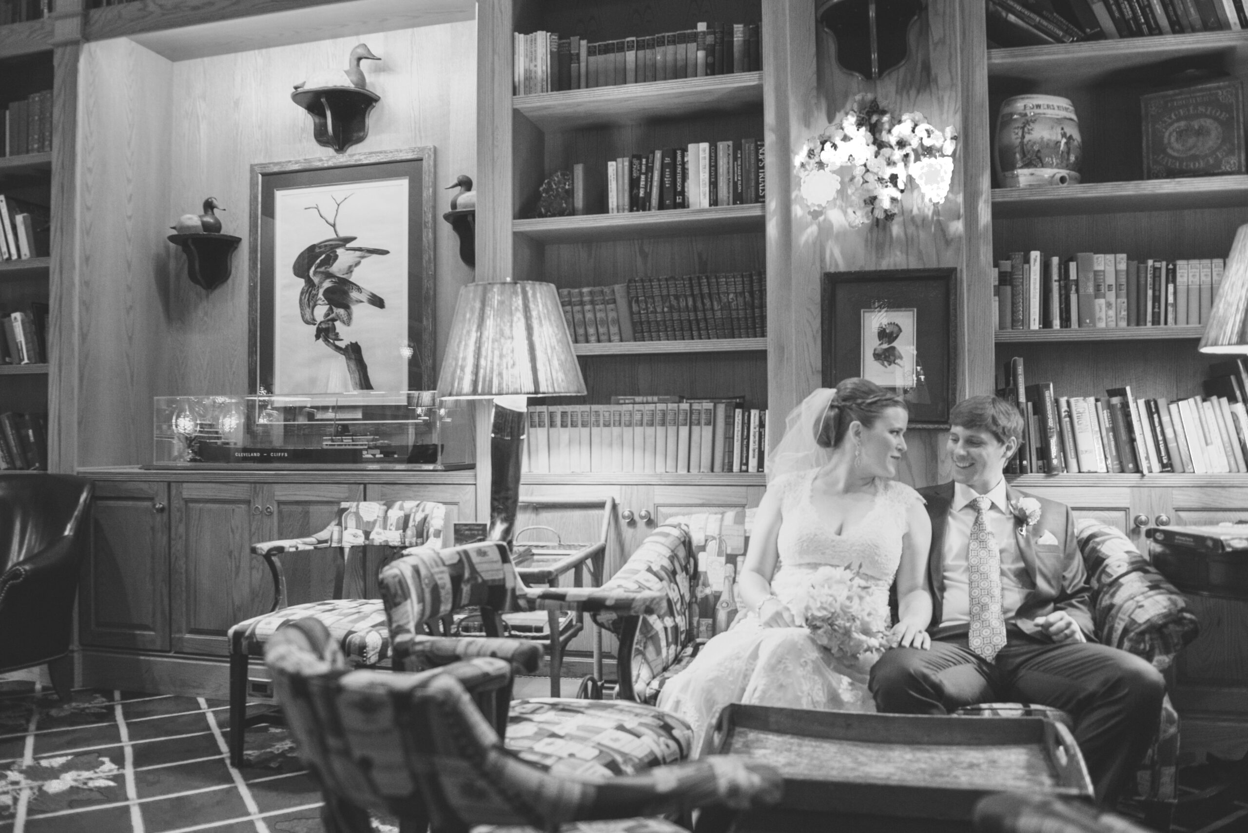 bride and groom candid in library after wedding ceremony