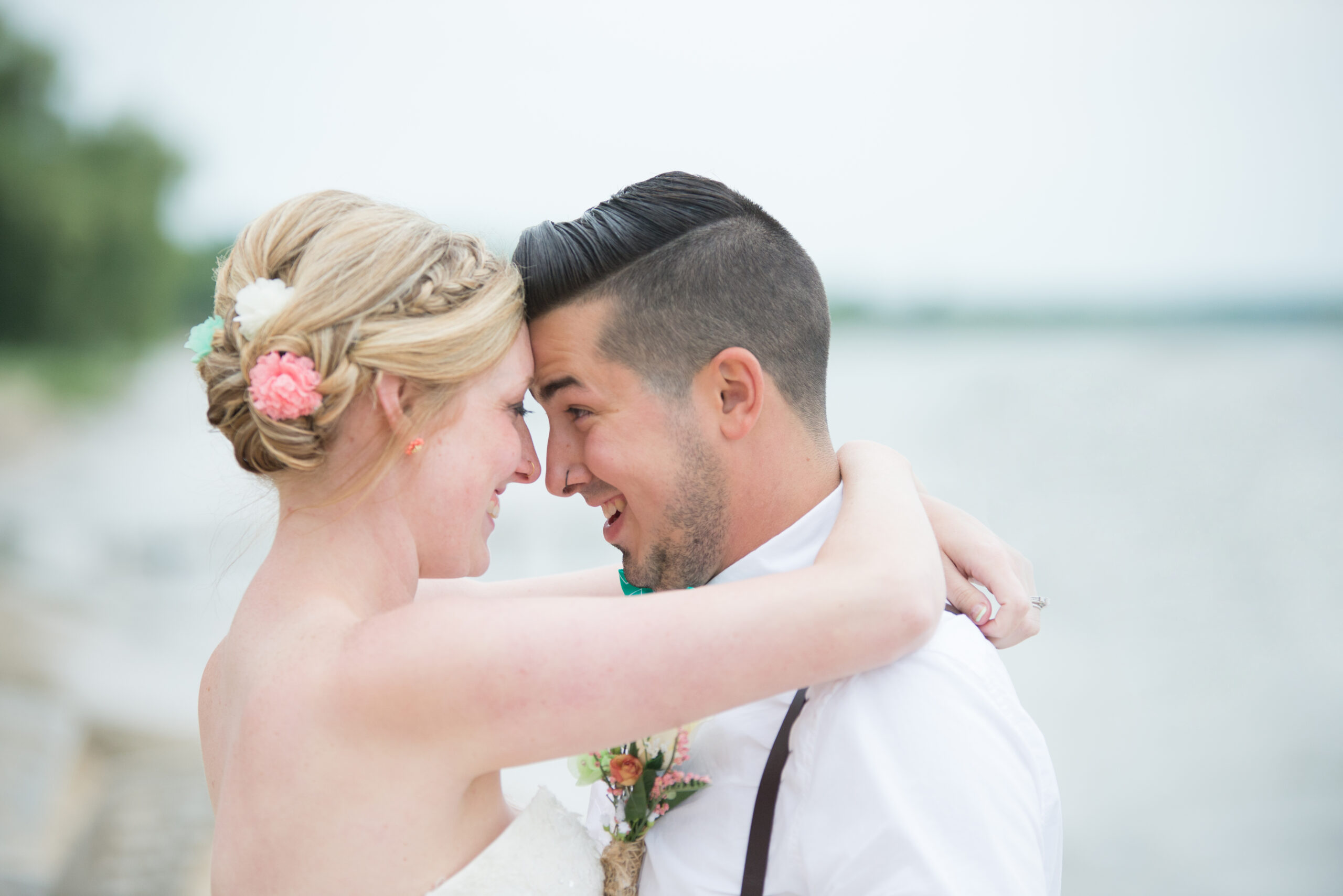 candid of bride and groom smiling excitedly after wedding ceremony