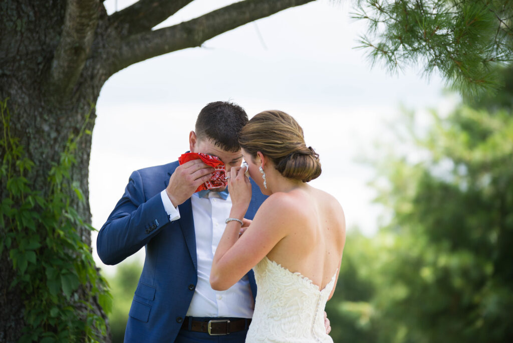 bride and groom crying at first look in traverse city michigan