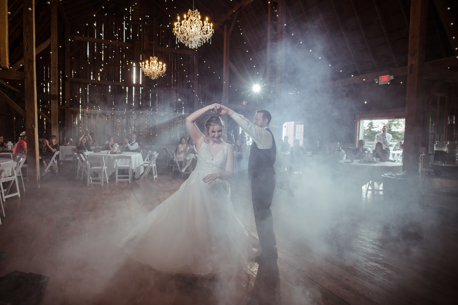 traverse city barn wedding venue with bride and groom dancing in fog