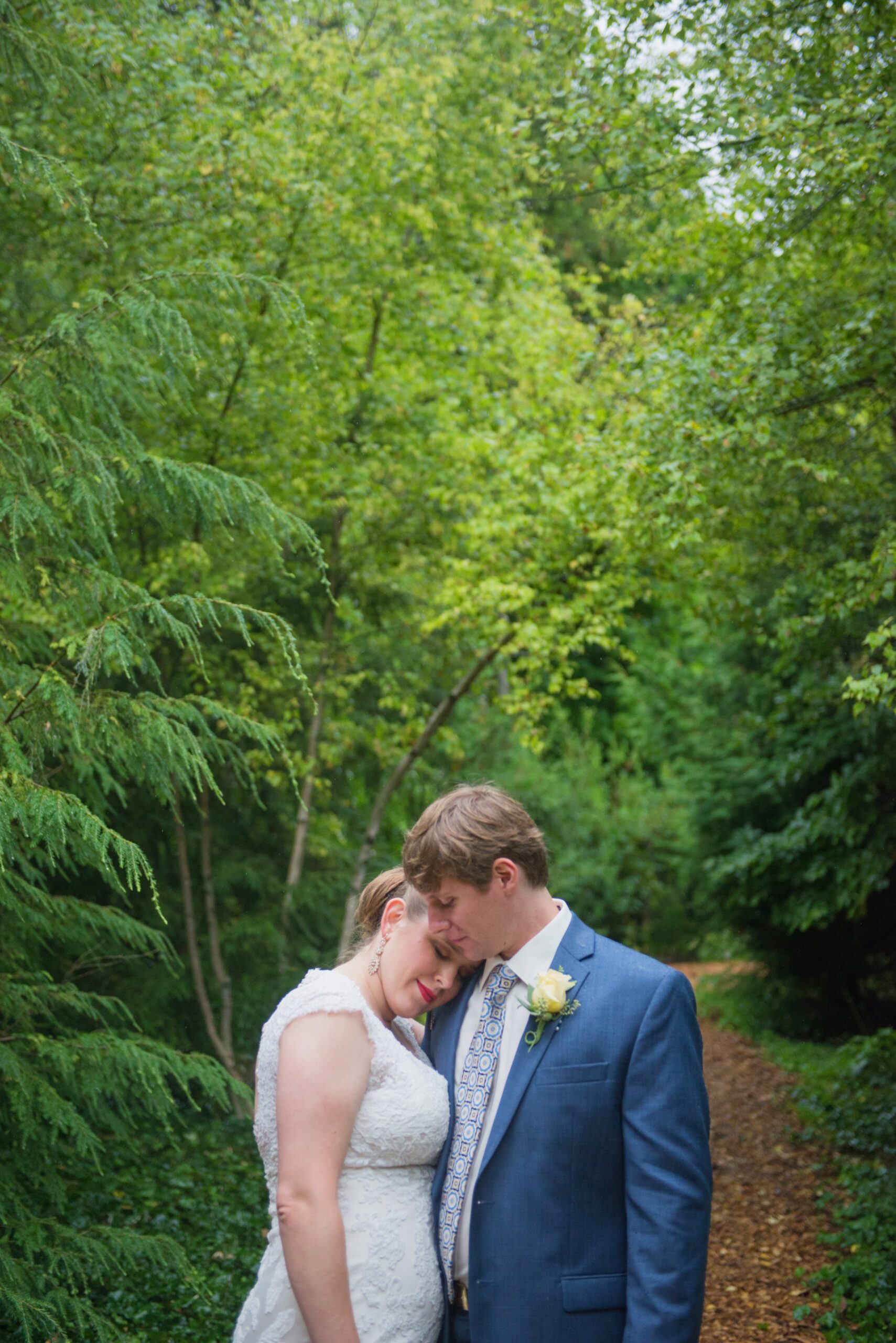 Bride and groom in he woods of the Grand Hotel on Mackinac Island Michigan