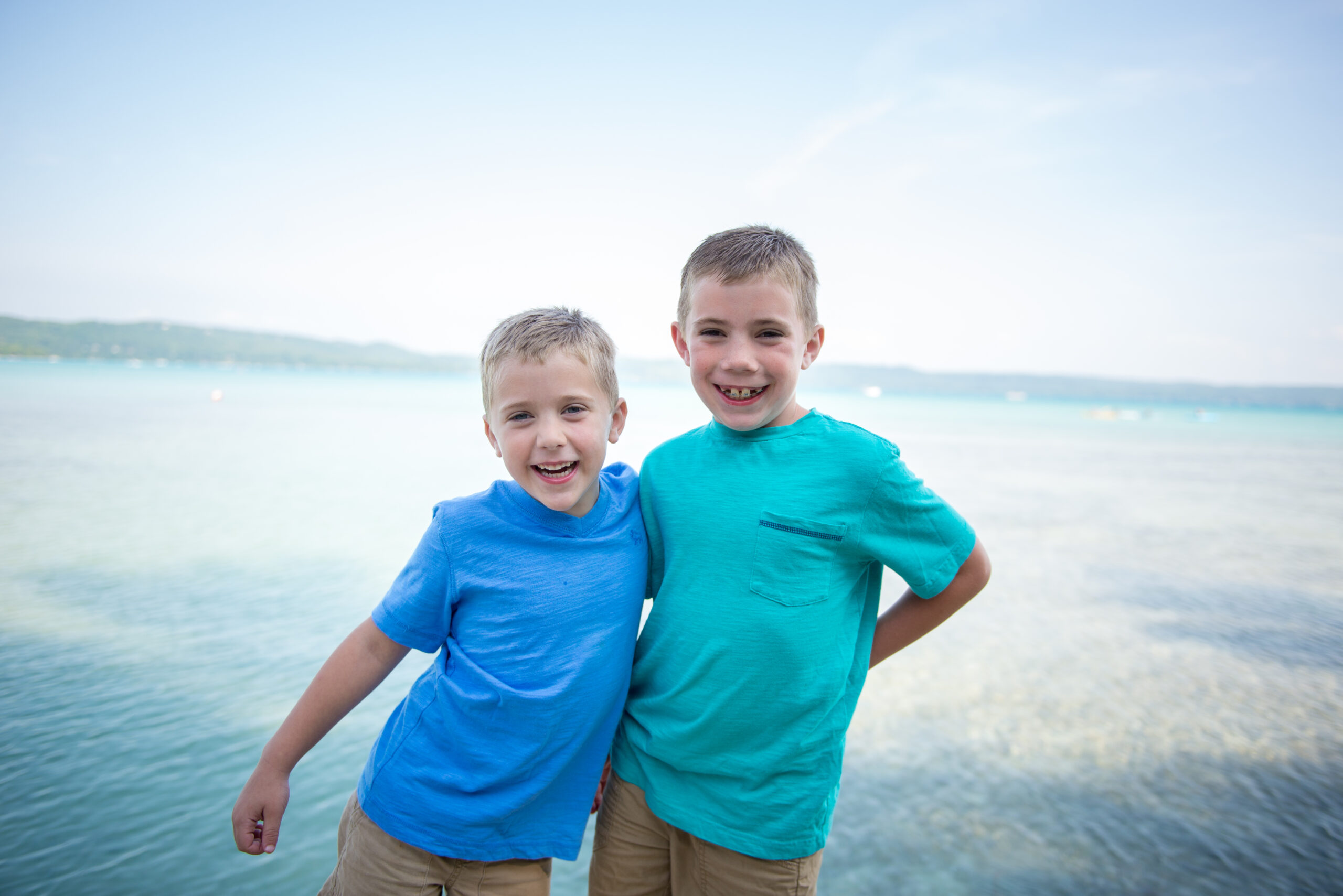 two brothers hugging during family potraits in Glen Arbor michigan