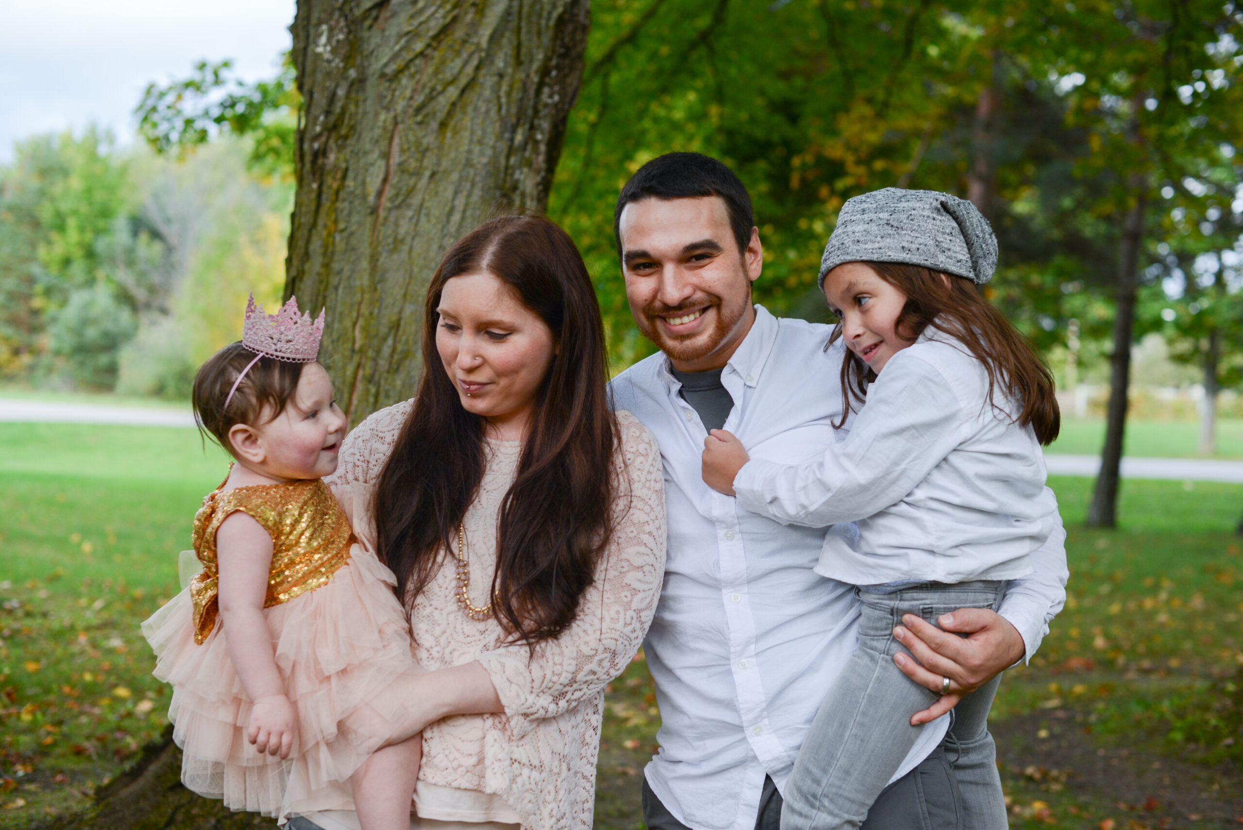 family pictures of family of four casual candid laughing in traverse city northern michgian