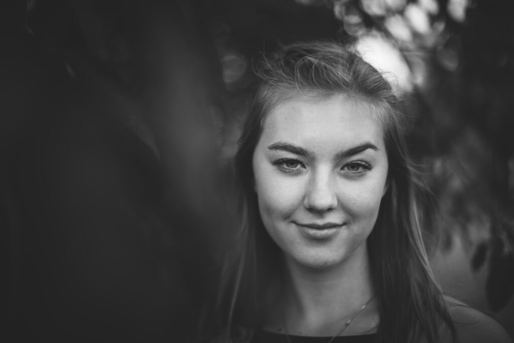girl posing seriously for a senior picture in traversecity michigan