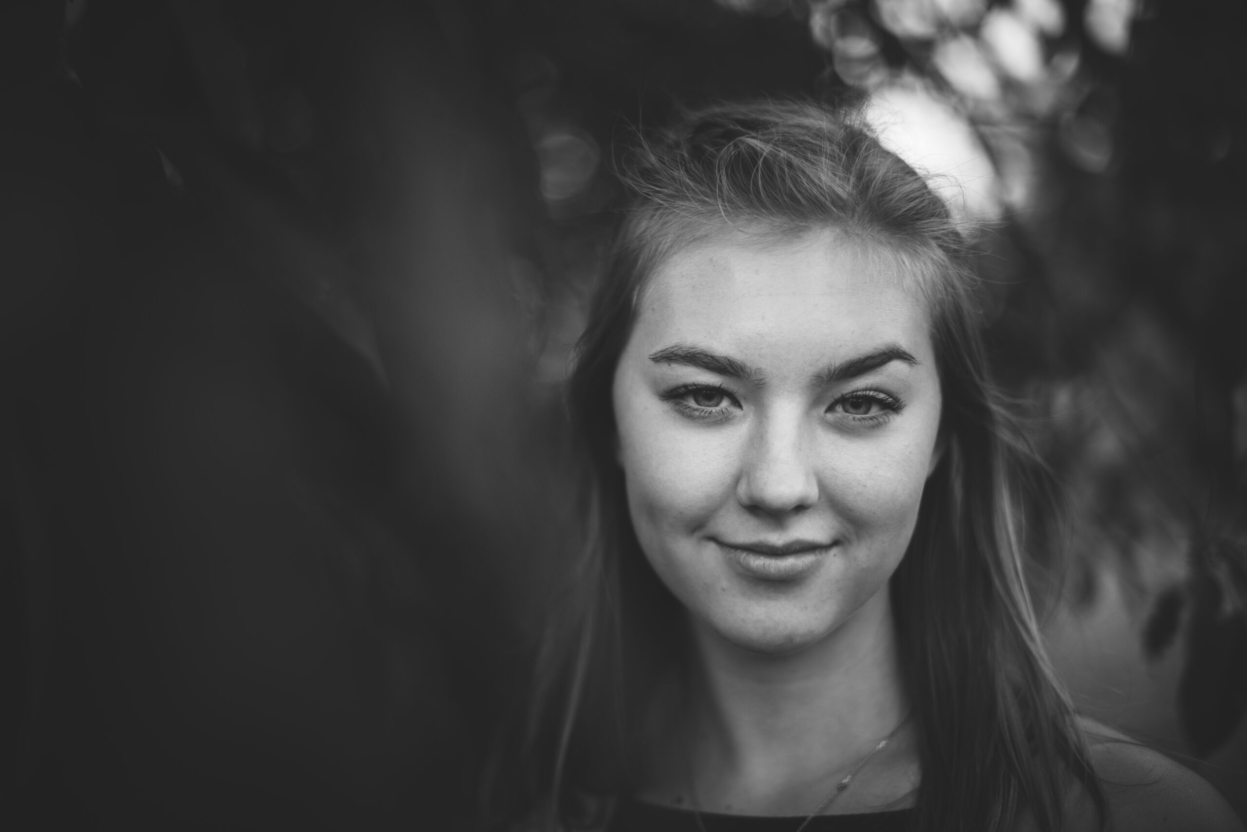 girl posing seriously for a senior picture in traversecity michigan
