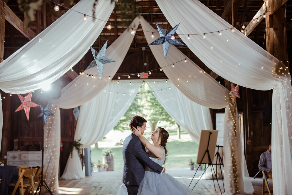 bride and groom dancing in barn with celestial theme wedding in traverse city michigan
