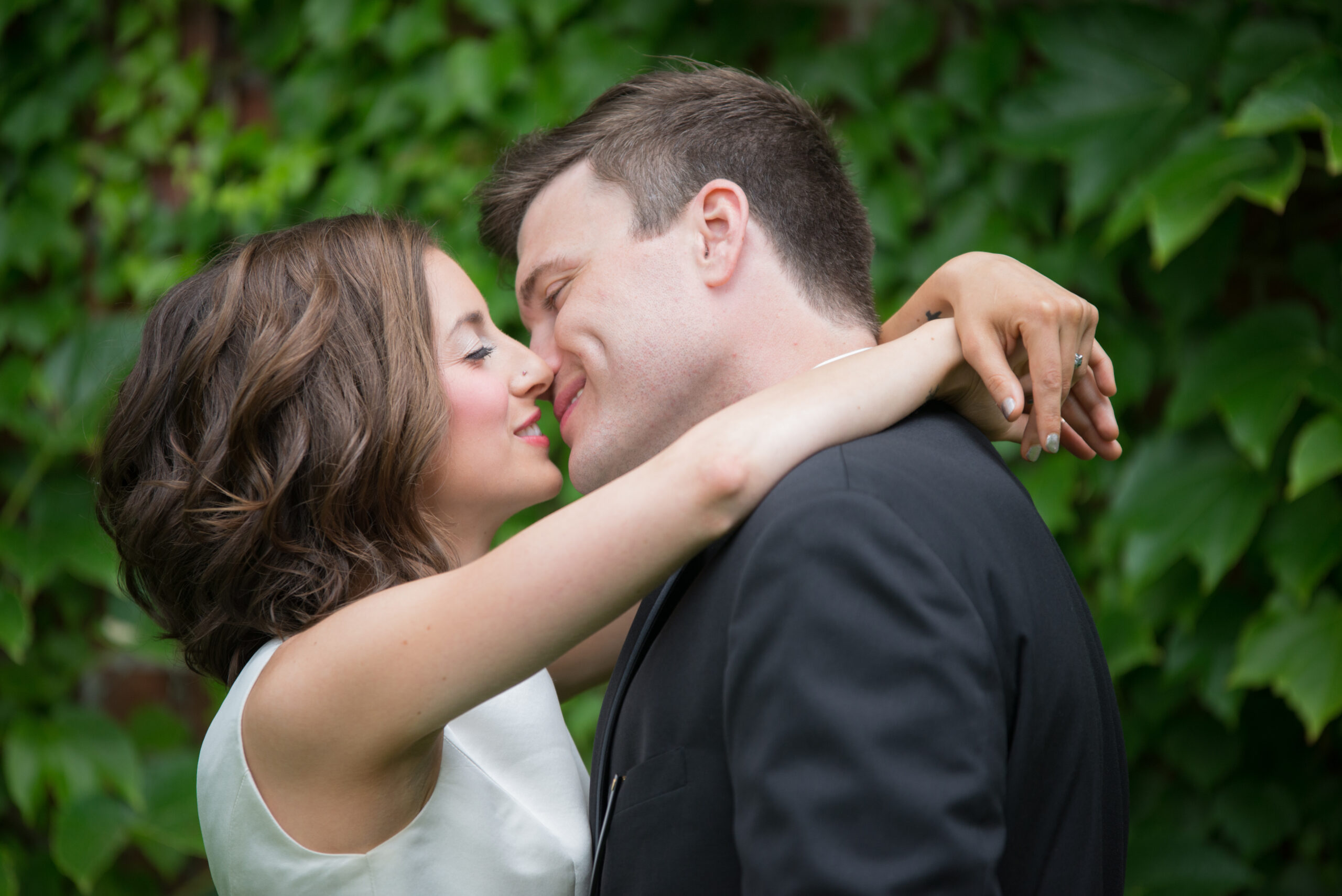 retro-wedding-traverse-city-michigan bride and groom almost kiss in downtown traverse city michigan