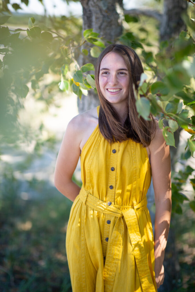 senior-girl-empire-beach-senior-photos-northern-michigan-photographer girl walking on beach during traverse city senior photos