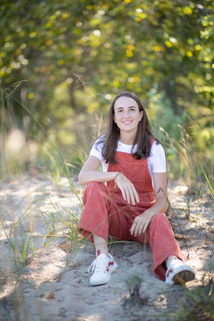 senior-girl-empire-beach-senior-photos-northern-michigan-photographer girl walking on beach during traverse city senior photos