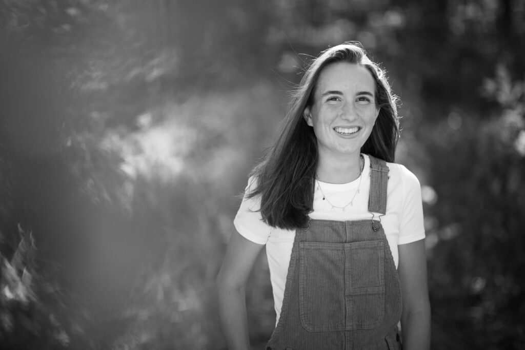 senior-girl-empire-beach-senior-photos-northern-michigan-photographer girl walking in woods during traverse city senior photos