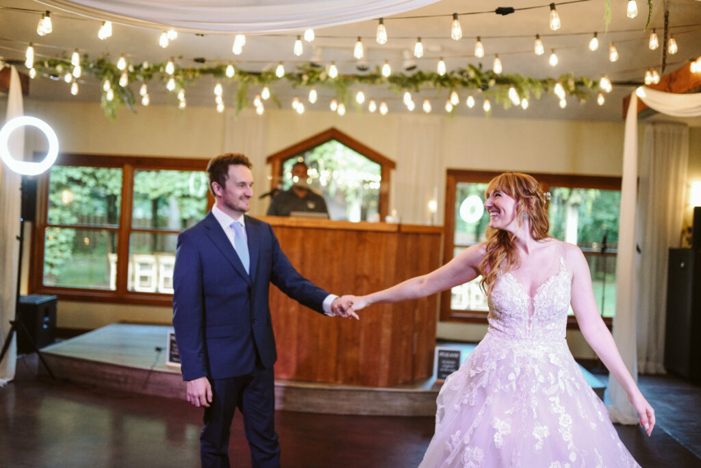 bride and groom at blue bridge event center in grawn michigan traverse city wedding photographer