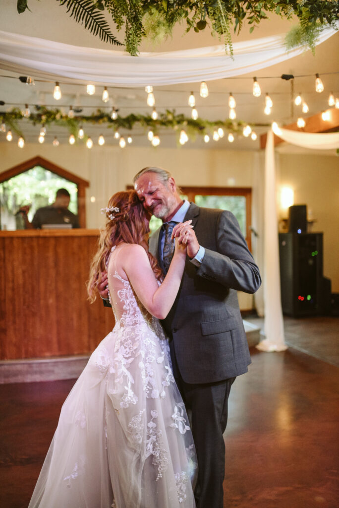 bride and dad at blue bridge event center in grawn michigan traverse city wedding photographer