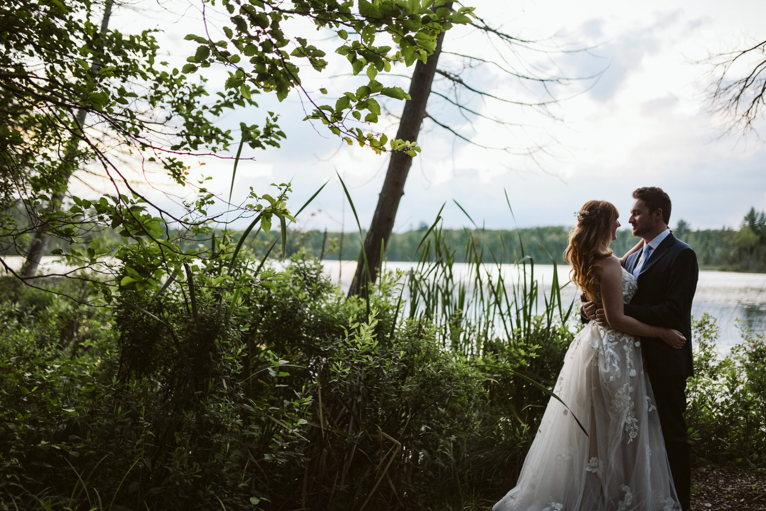 bride and groom at blue bridge event center in grawn michigan traverse city wedding photographer