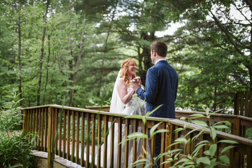 bride and groom at blue bridge event center in grawn michigan traverse city wedding photographer