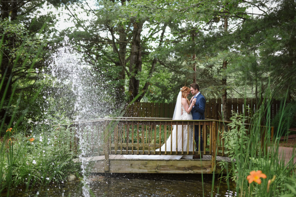 bride and groom at blue bridge event center in grawn michigan traverse city wedding photographer