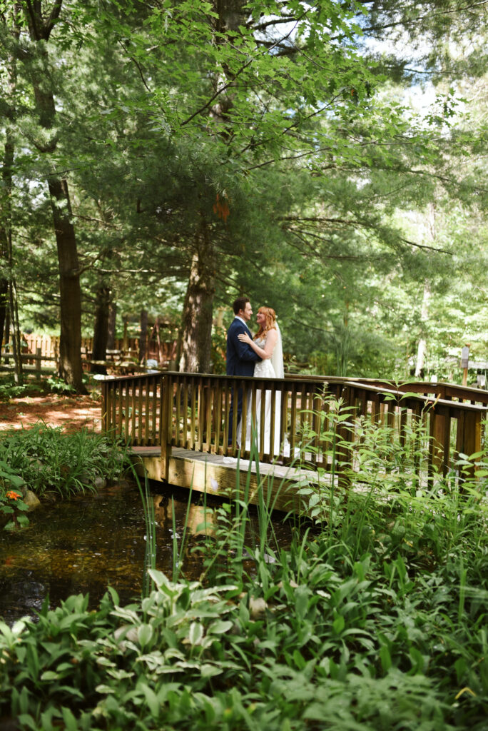 bride and groom at blue bridge event center in grawn michigan traverse city wedding photographer