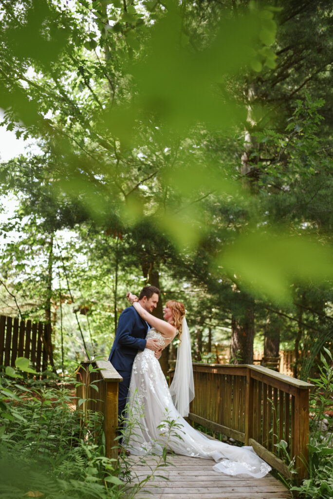 bride and groom at blue bridge event center in grawn michigan traverse city wedding photographer