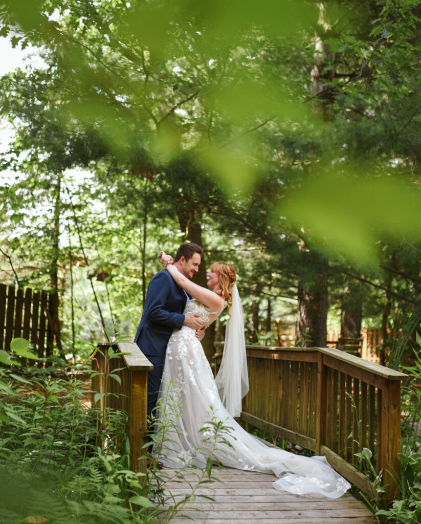 bride and groom at blue bridge event center in grawn michigan traverse city wedding photographer