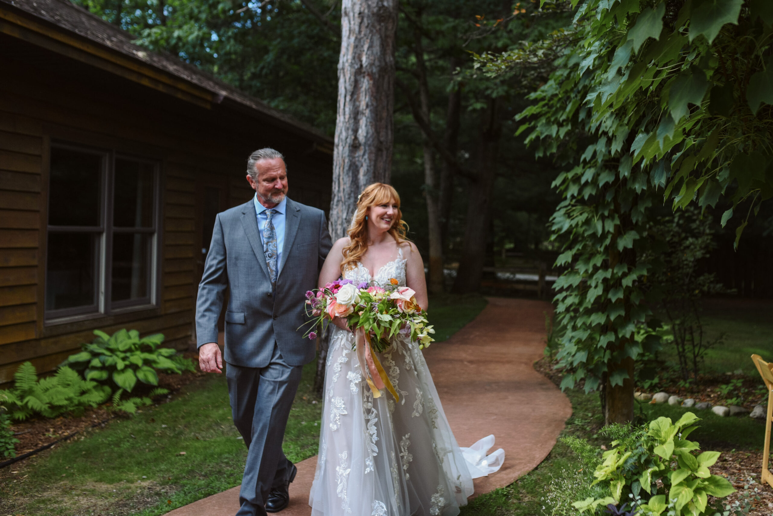 ceremony at blue bridge event center in grawn michigan traverse city wedding photographer