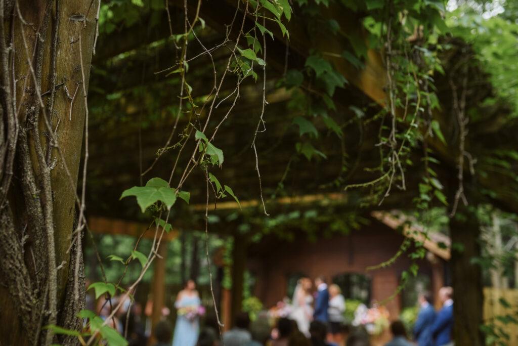 ceremony at blue bridge event center in grawn michigan traverse city wedding photographer