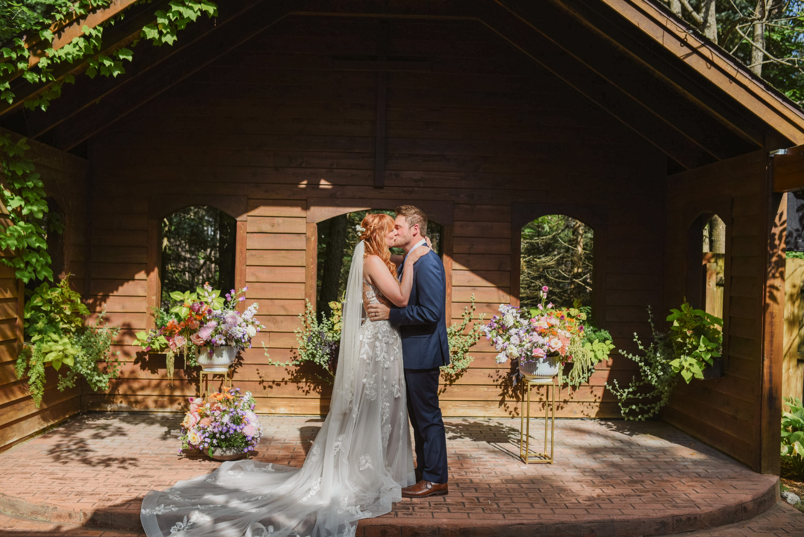 ceremony at blue bridge event center in grawn michigan traverse city wedding photographer