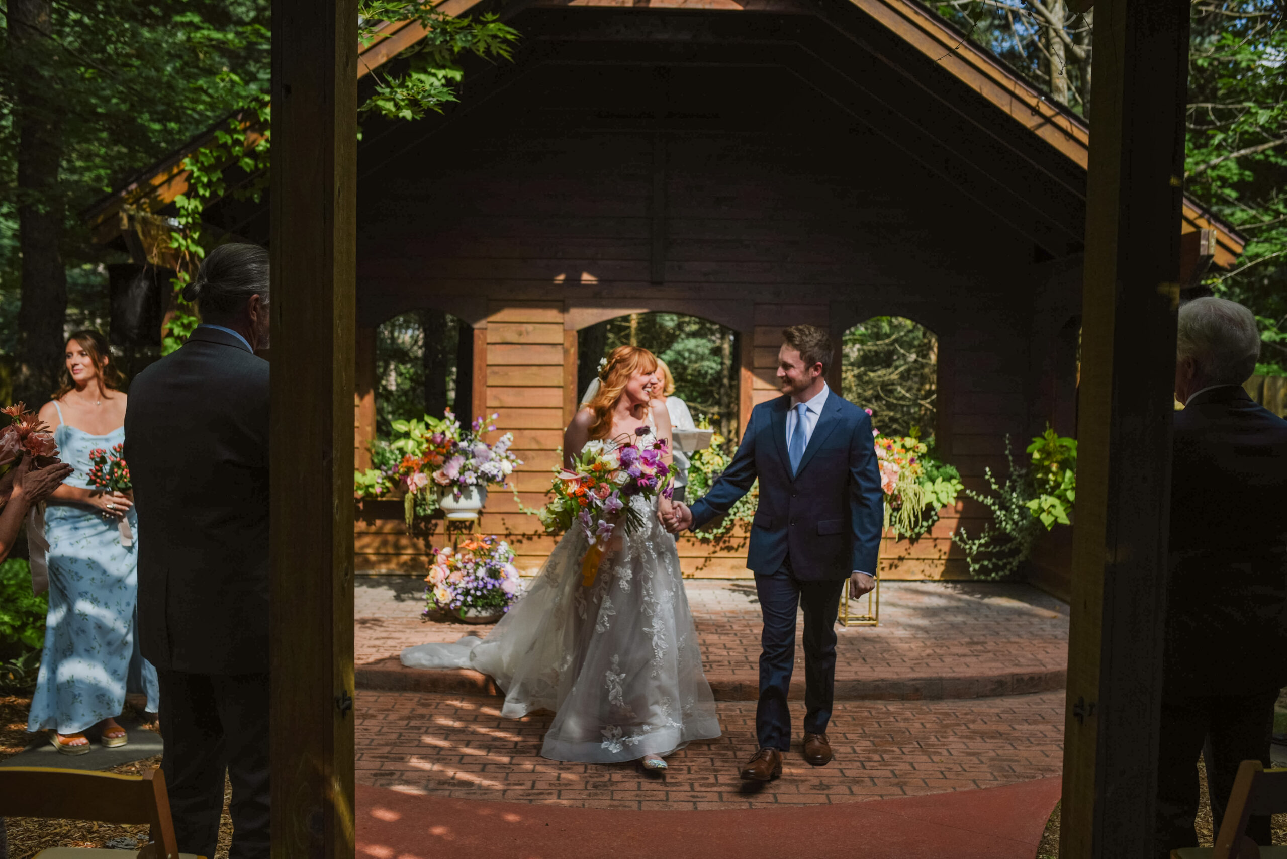 ceremony at blue bridge event center in grawn michigan traverse city wedding photographer