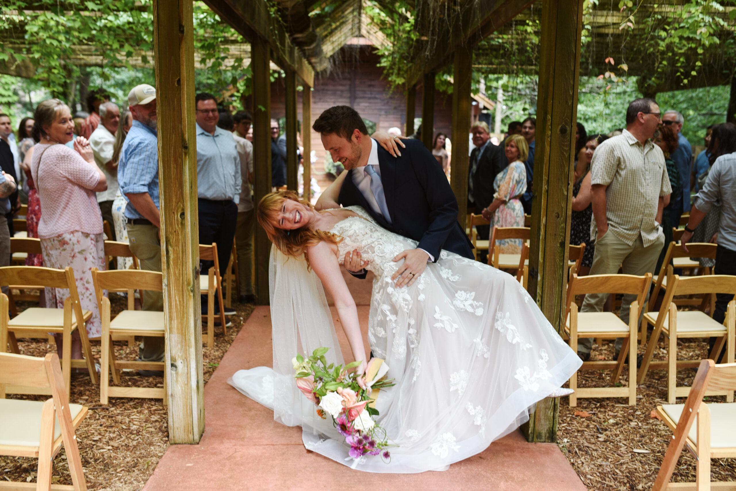 ceremony at blue bridge event center in grawn michigan traverse city wedding photographer