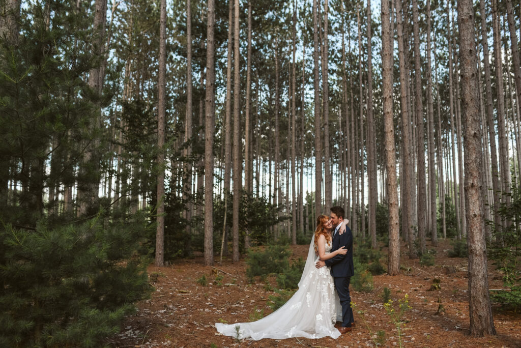 bride and groom at blue bridge event center in grawn michigan traverse city wedding photographer