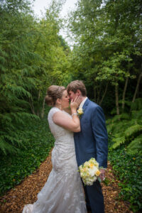 bride and groom walking on mackinac island in rain northern michigan wedding photographer