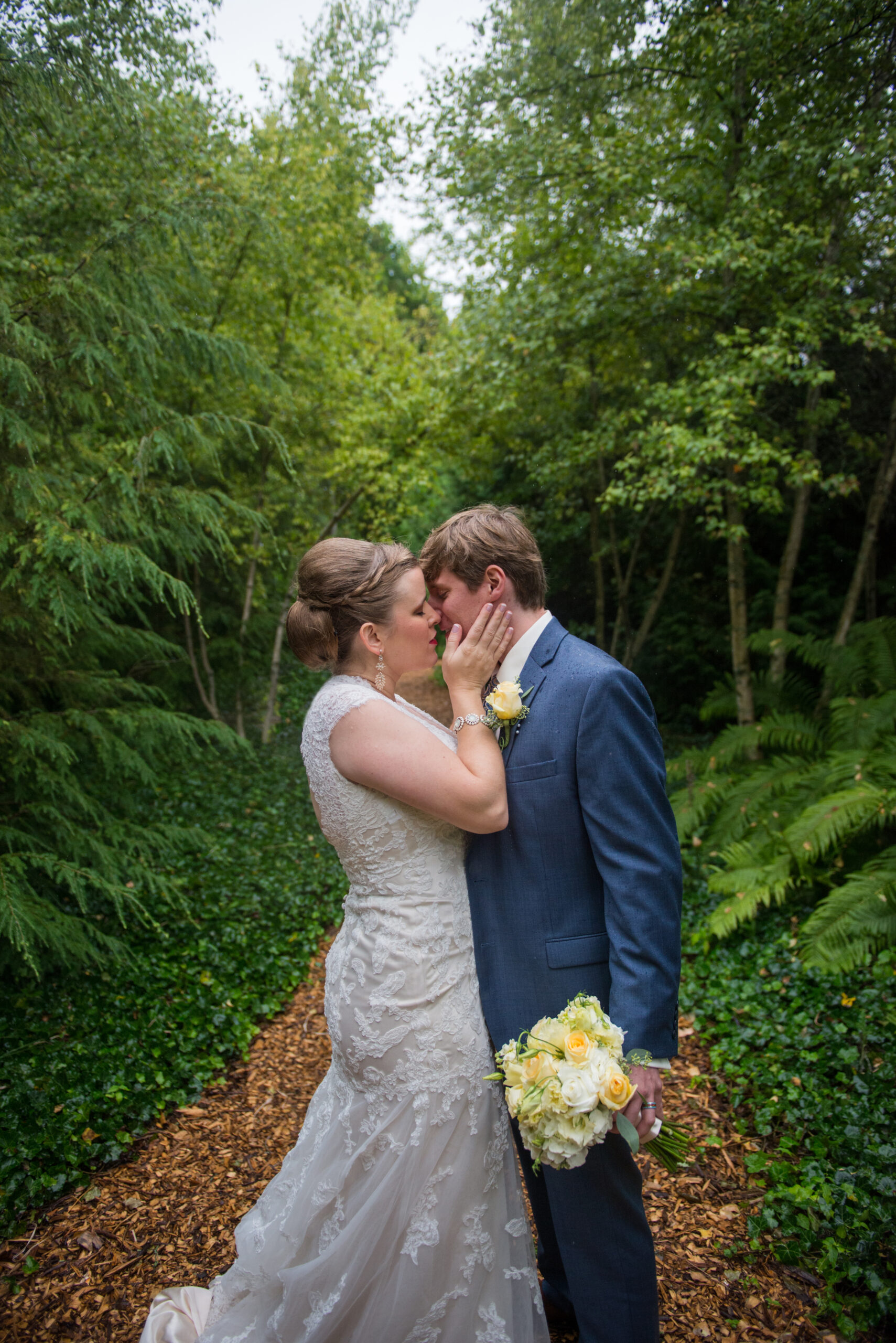 bride and groom walking on mackinac island in rain northern michigan wedding photographer