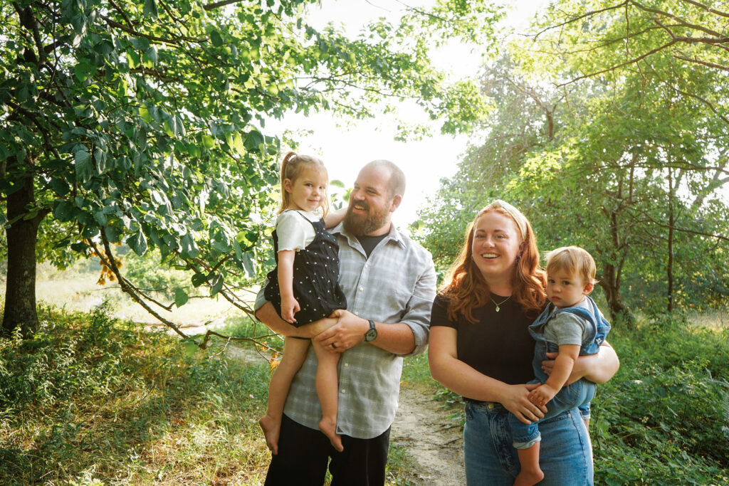 family at beach during family photos in empire michigan traverse city potographer