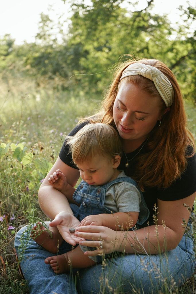 family posing on esche beach in empire michigan traverse city wedding photographer