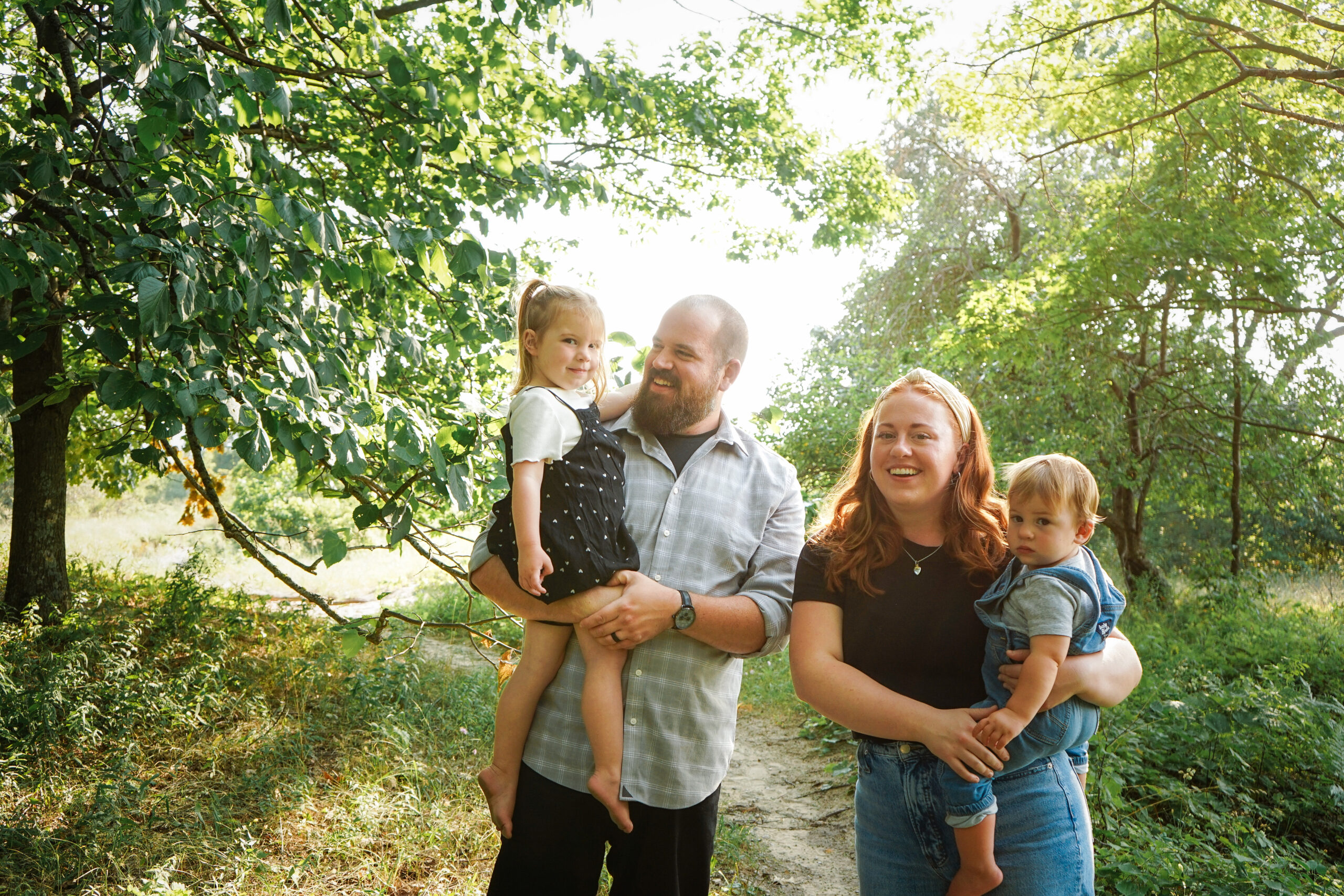 family at beach during family photos in empire michigan traverse city potographer