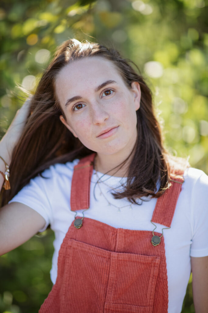 girl on empire beach taking senior pictures in empire michigan traverse city photographer