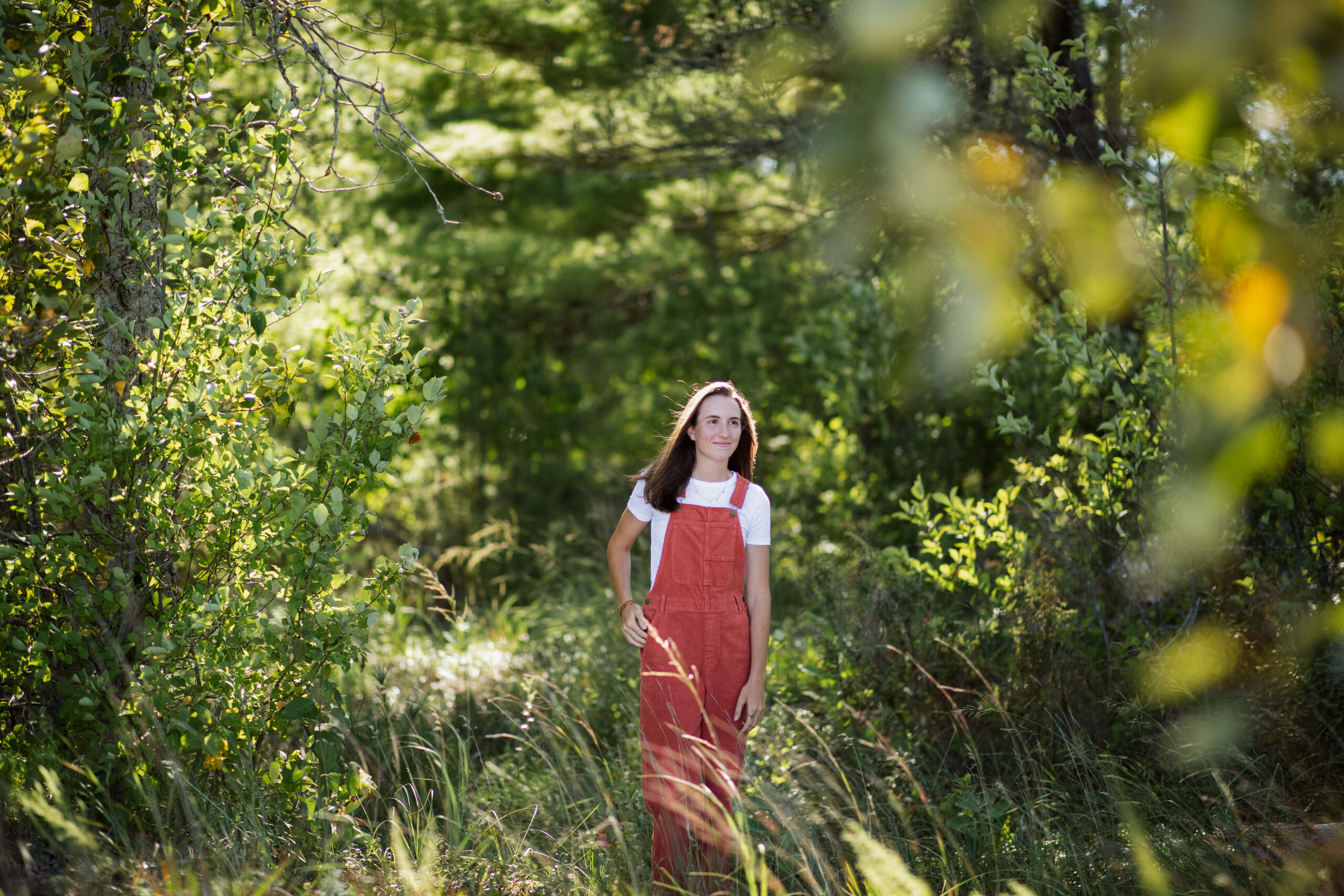 girl on empire beach taking senior pictures in empire michigan traverse city photographer