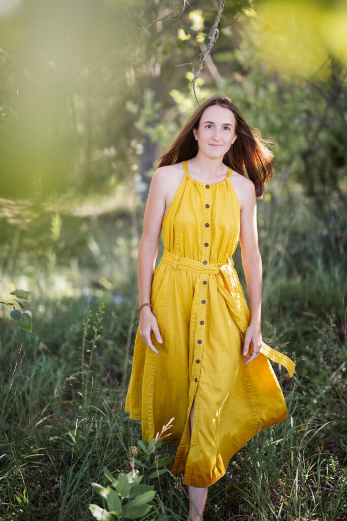 girl on empire beach taking senior pictures in empire michigan traverse city photographer