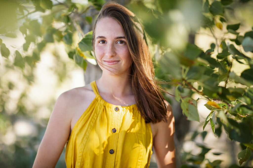 girl on empire beach taking senior pictures in empire michigan traverse city photographer