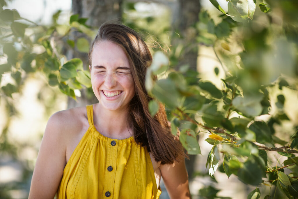 girl on empire beach taking senior pictures in empire michigan traverse city photographer