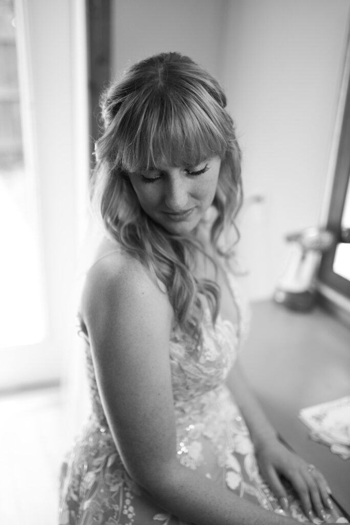 bride sitting at blue bridge at wedding in traverse city michigan wedding photography