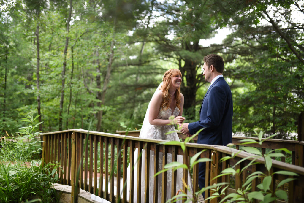 bride and groom during first look at blue bridge event center wedding in traverse city michigan wedding photography