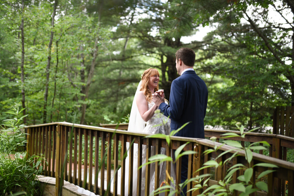 bride and groom during first look at blue bridge event center wedding in traverse city michigan wedding photography