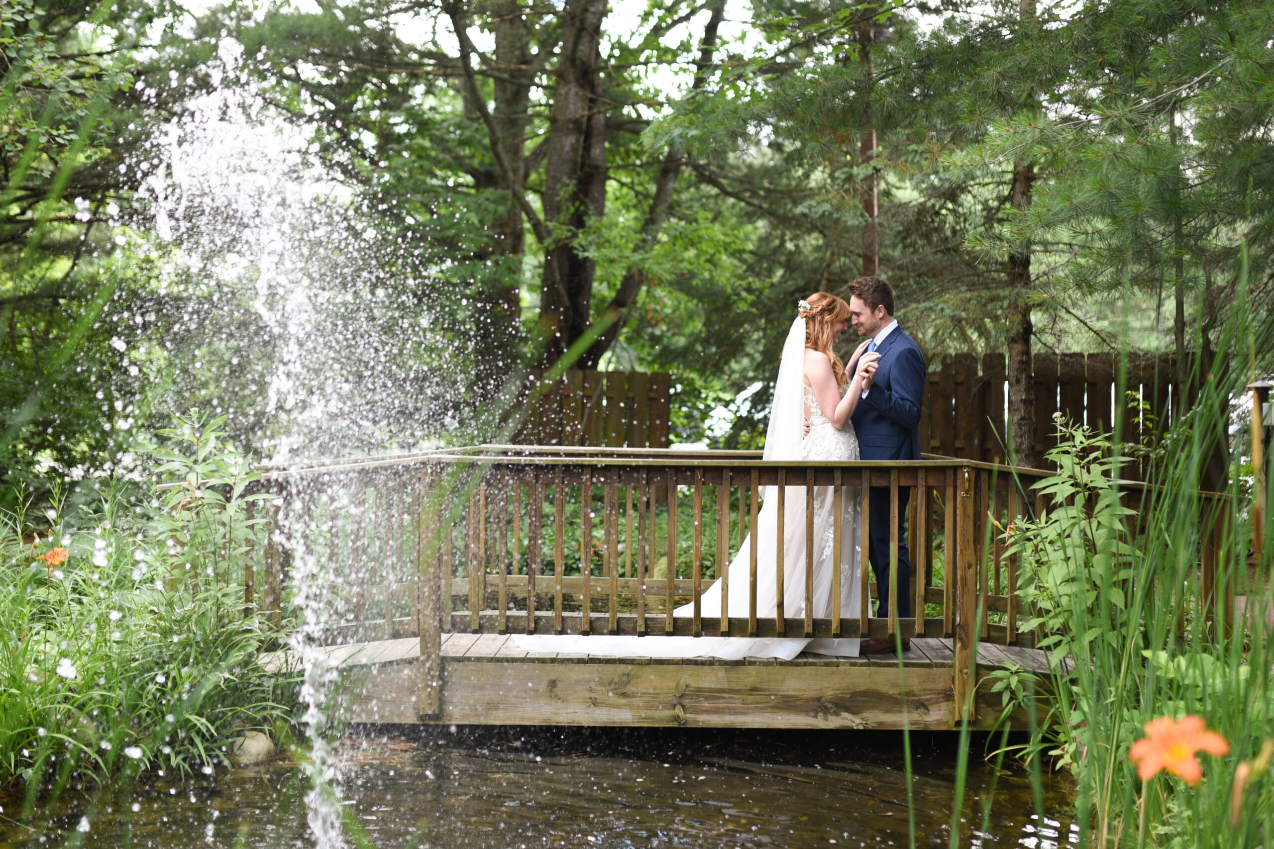 bride and groom during first look at blue bridge event center wedding in traverse city michigan wedding photography