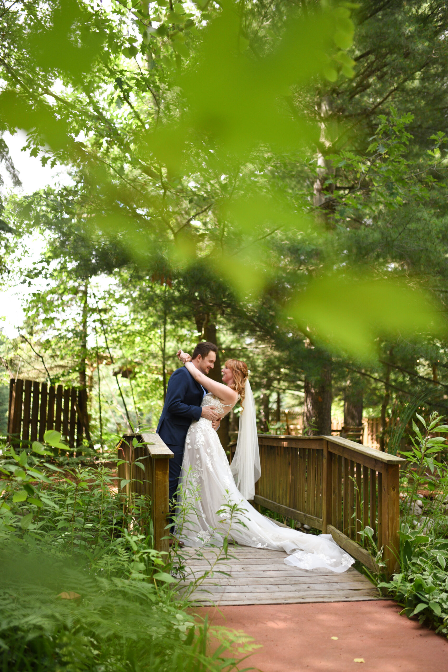 bride and groom during first look at blue bridge event center wedding in traverse city michigan wedding photography