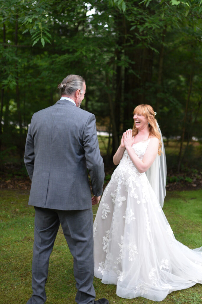 bride and father first look at blue bridge event center wedding in traverse city michigan wedding photography