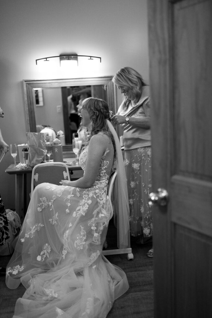 bride during prep at blue bridge event center wedding in traverse city michigan wedding photography