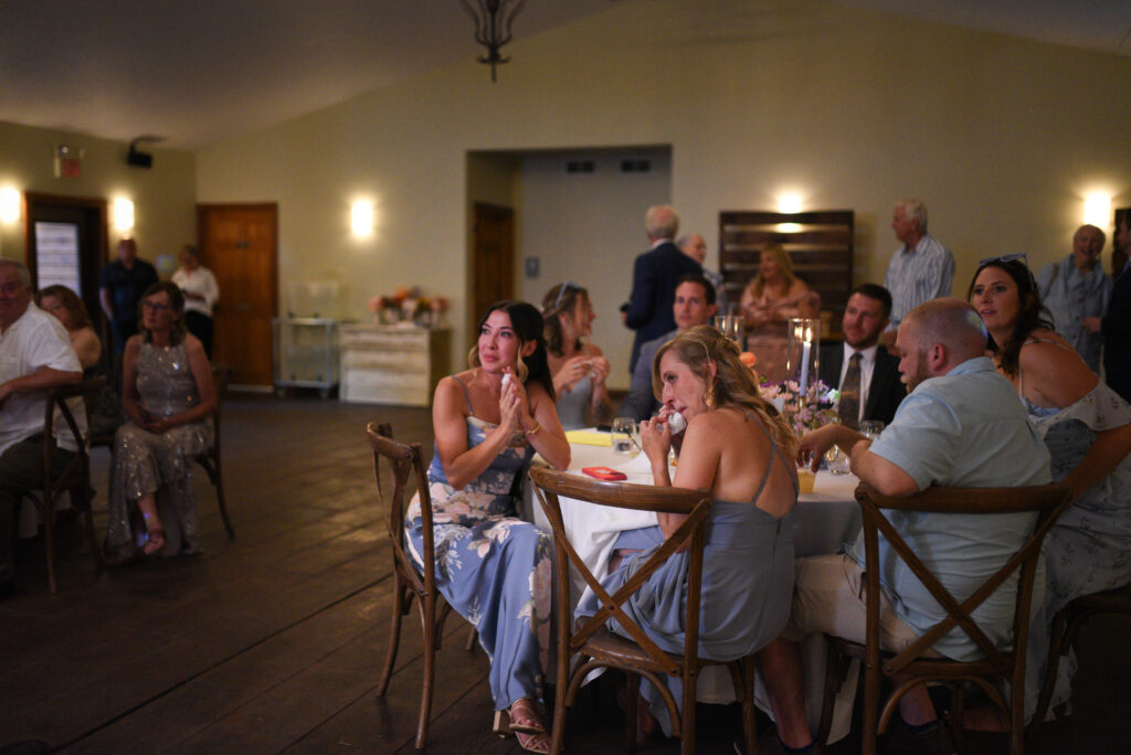 guests crying during father daughter dance at wedding in traverse city michigan wedding photography