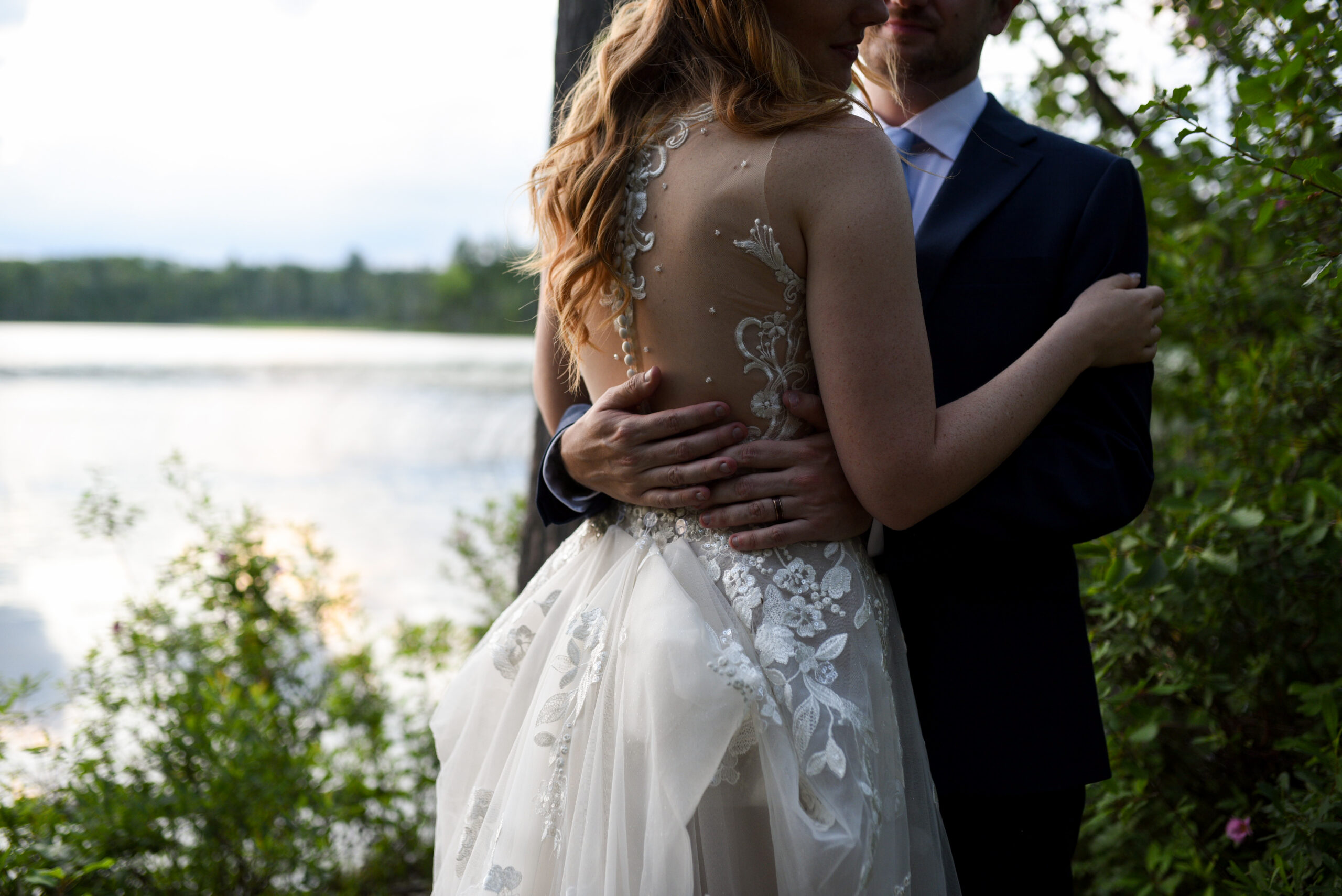 bride and groom at sunset at blue bridge event center wedding in traverse city michigan Northern Michigan Wedding Photography